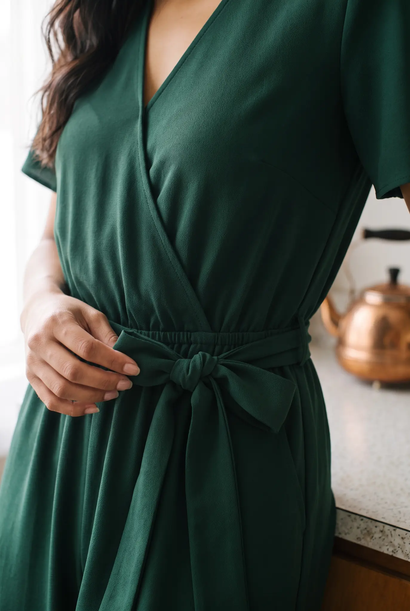 Fabric focus campaign image featuring the emerald jumpsuit